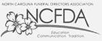 A black and white logo for the north carolina funeral directors association
