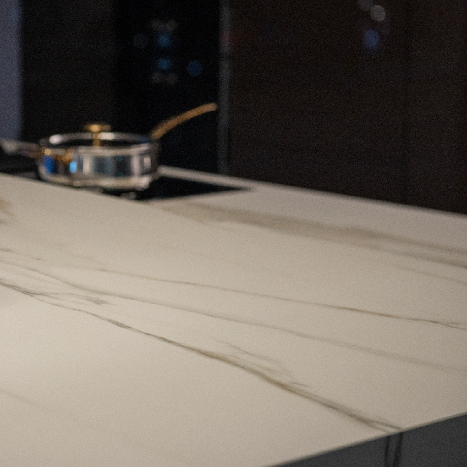 A pan is sitting on top of a white counter in a kitchen.