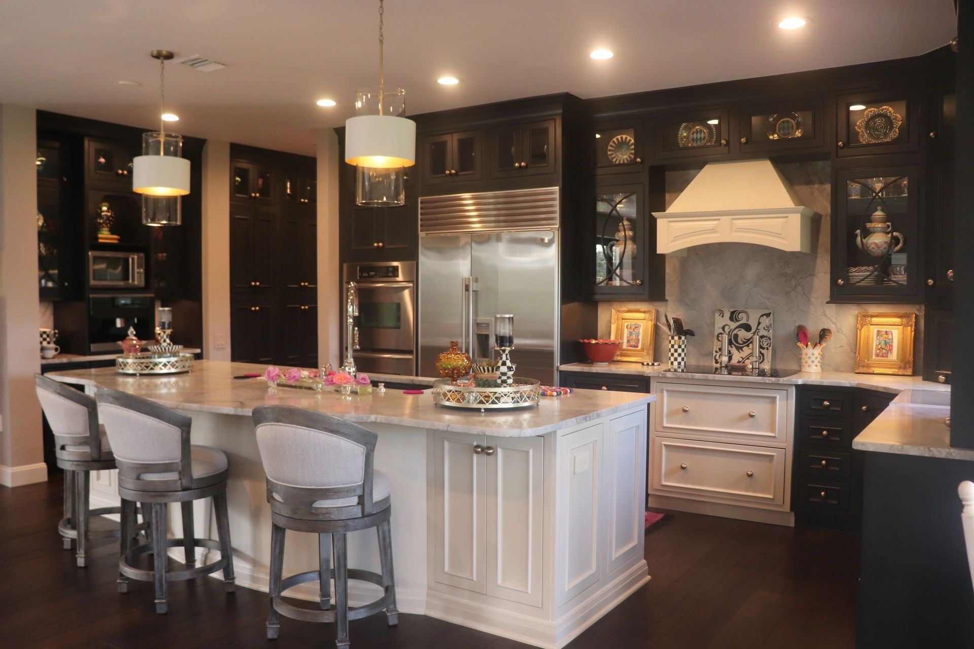 A large kitchen with a large island and stools.