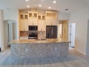 A kitchen with a large island in the middle of the room.