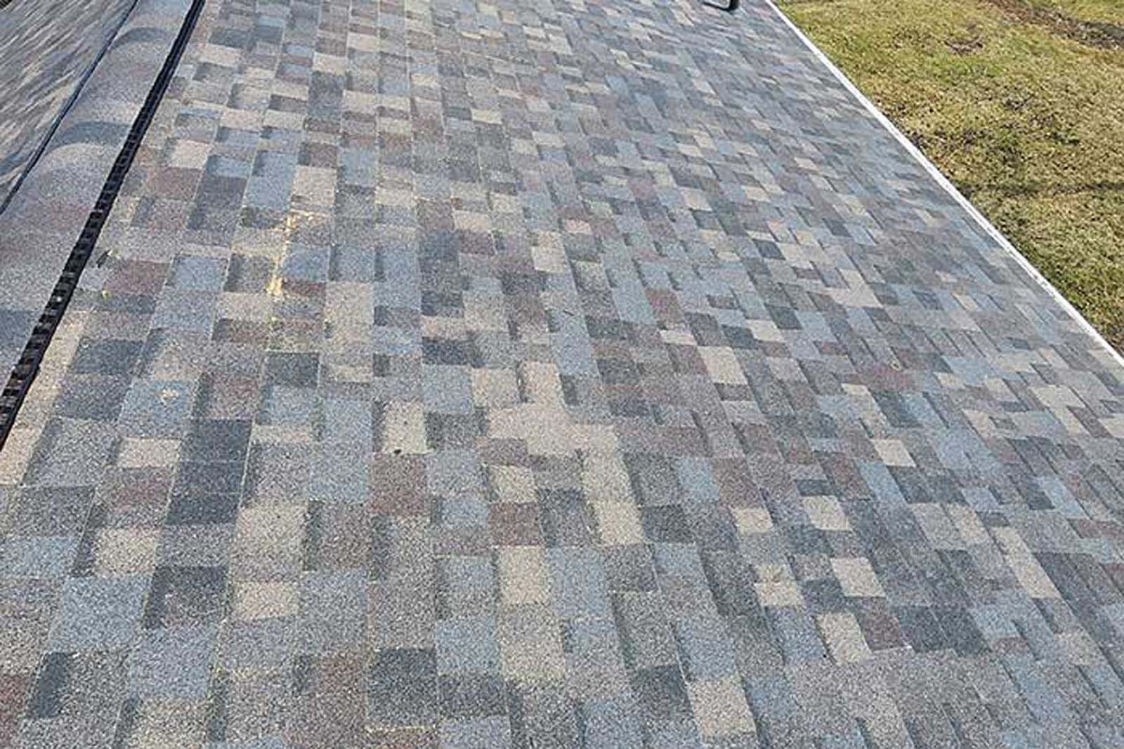 A close up of a roof with shingles on it.