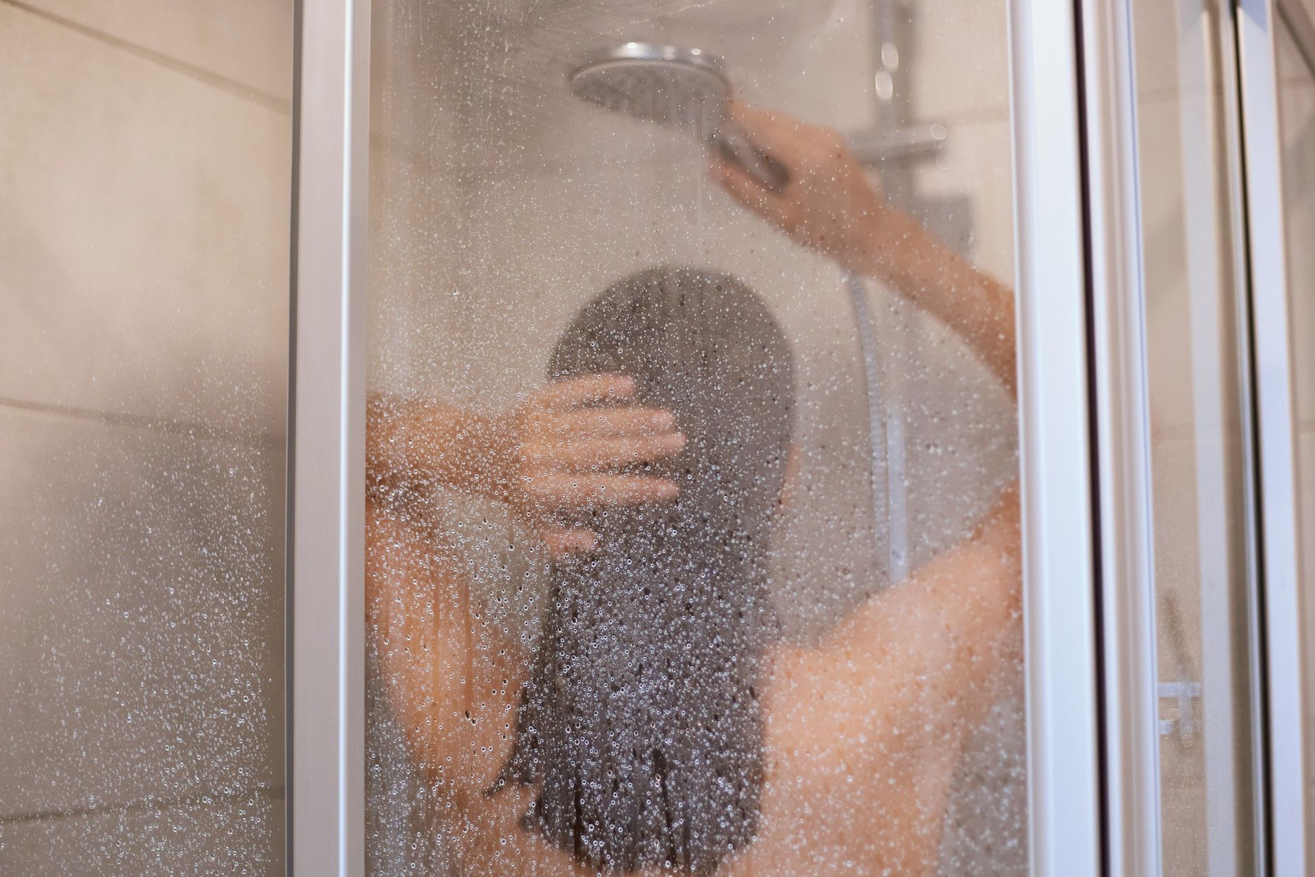 woman enjoying hot shower