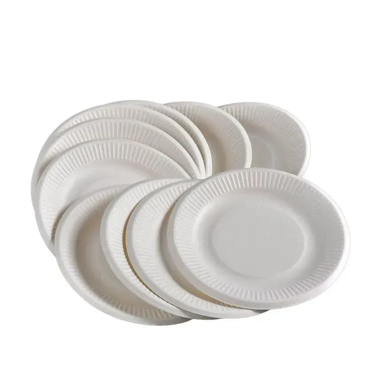 A stack of white paper plates on a white background.