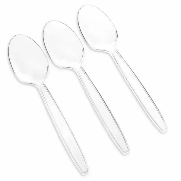 Three clear plastic spoons on a white background.