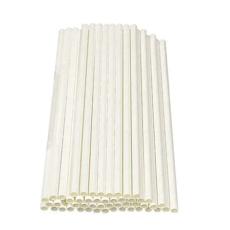 A pile of white paper straws on a white background.