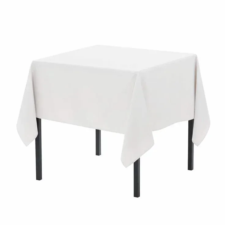 A square table with a white tablecloth and black legs.