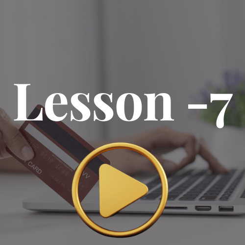 a person holding a credit card in front of a laptop that says lesson 7