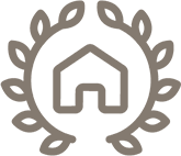 A house is surrounded by leaves in a circle.
