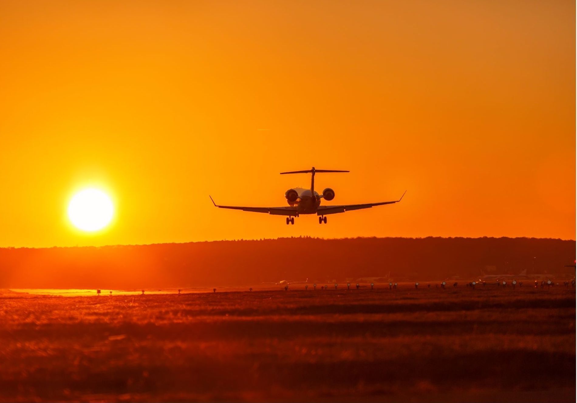 airplane landing or taking off at sunrise or sunset