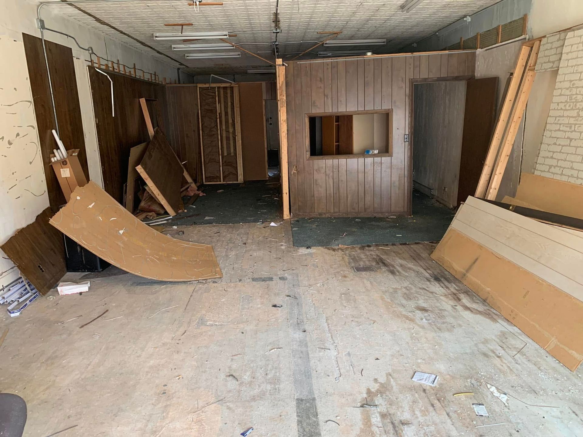 A room with a lot of wooden pieces on the floor