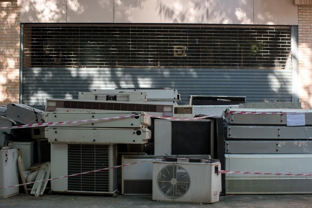A Bunch of Air Conditioners Are Stacked — Demco in Currumbin Waters, QLD