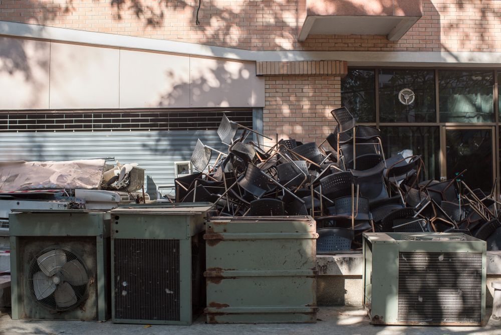 A Pile of Trash is Sitting in Front of a Building — Demco In Tweed Shire, NSW