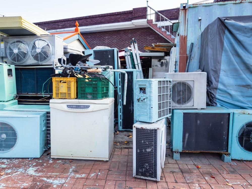 A Bunch of Old Appliances Are Stacked — Demco in Currumbin Waters, QLD