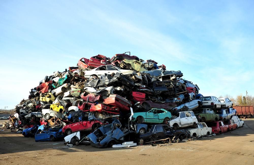 A Large Pile of Cars Are Stacked on Top of Each Other — Demco in Currumbin Waters, QLD