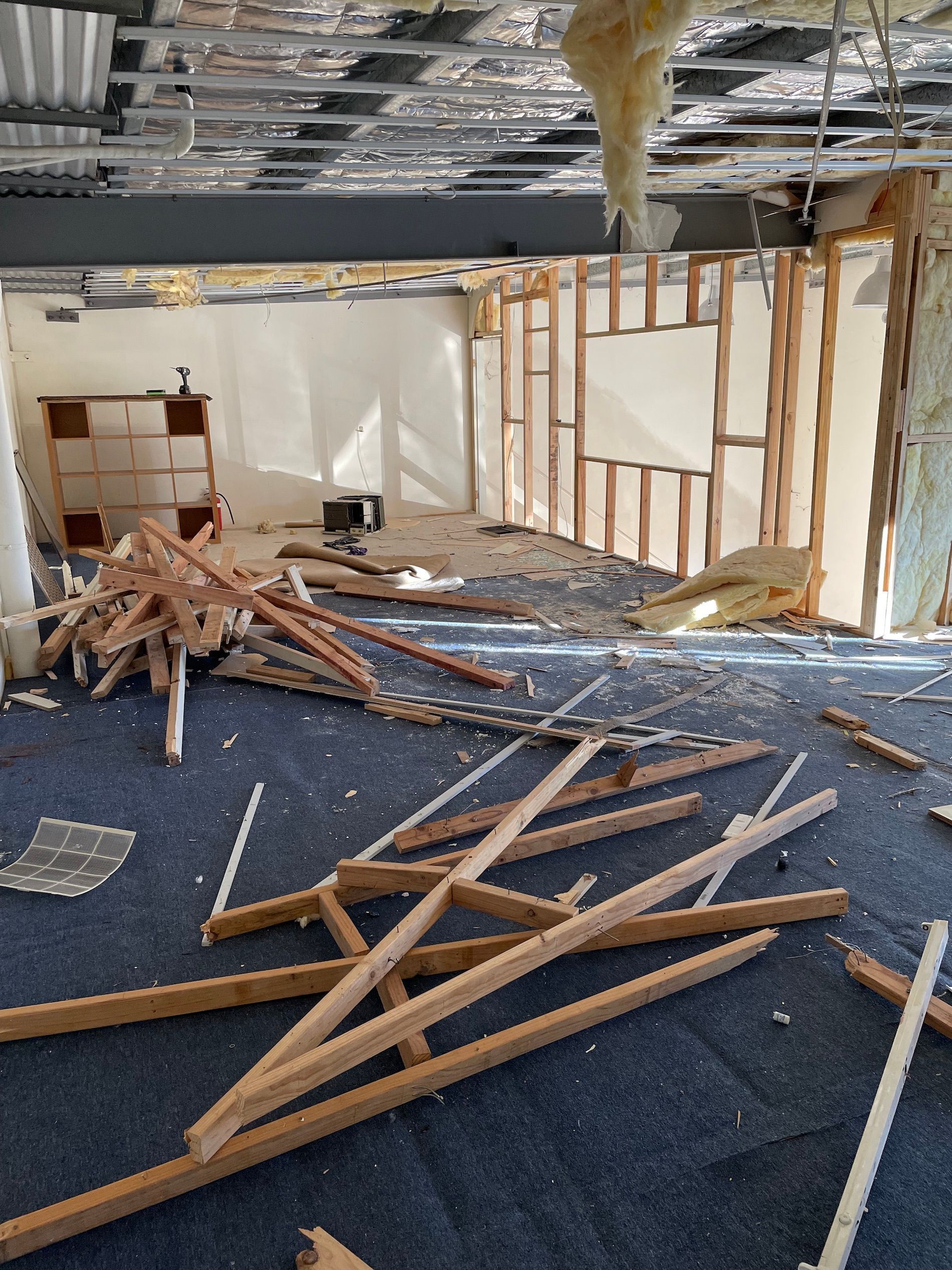 A room with a lot of wood laying on the floor — Demco In Currumbin Waters, QLD