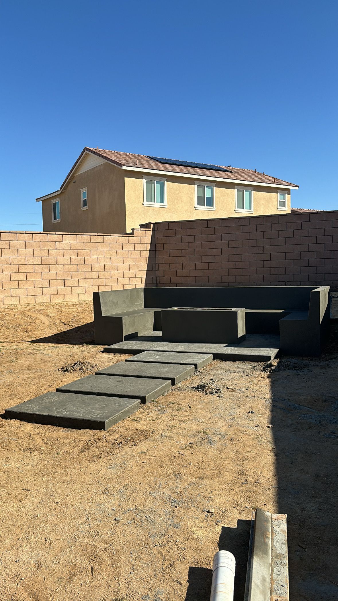 Concrete bench and stepping stones poured in Apple Valley California