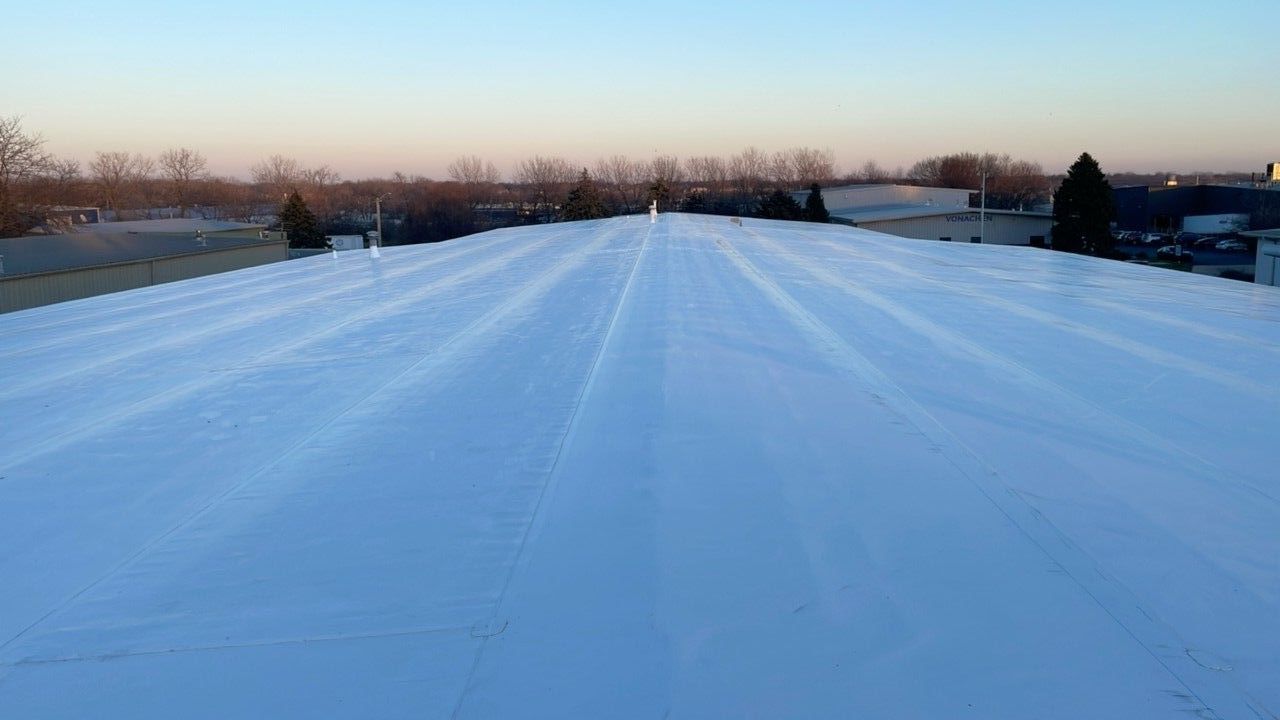 The roof of a building is covered in snow.