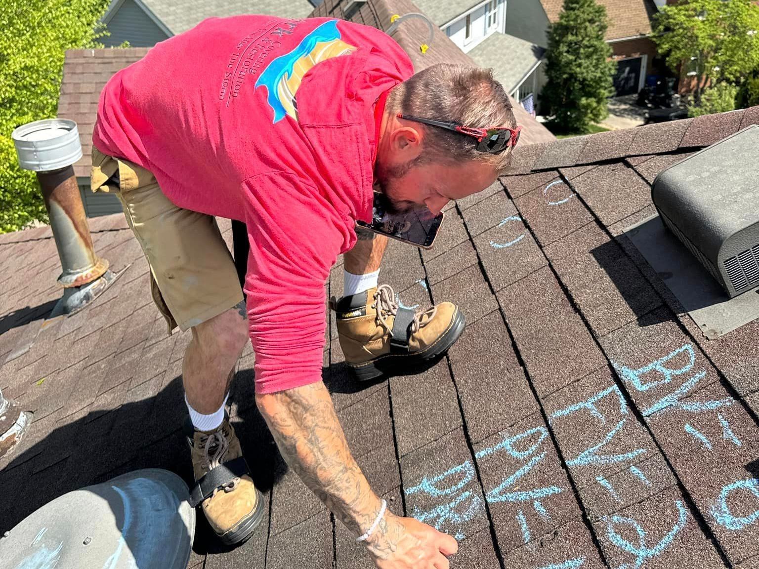 A man is working on the roof of a house.