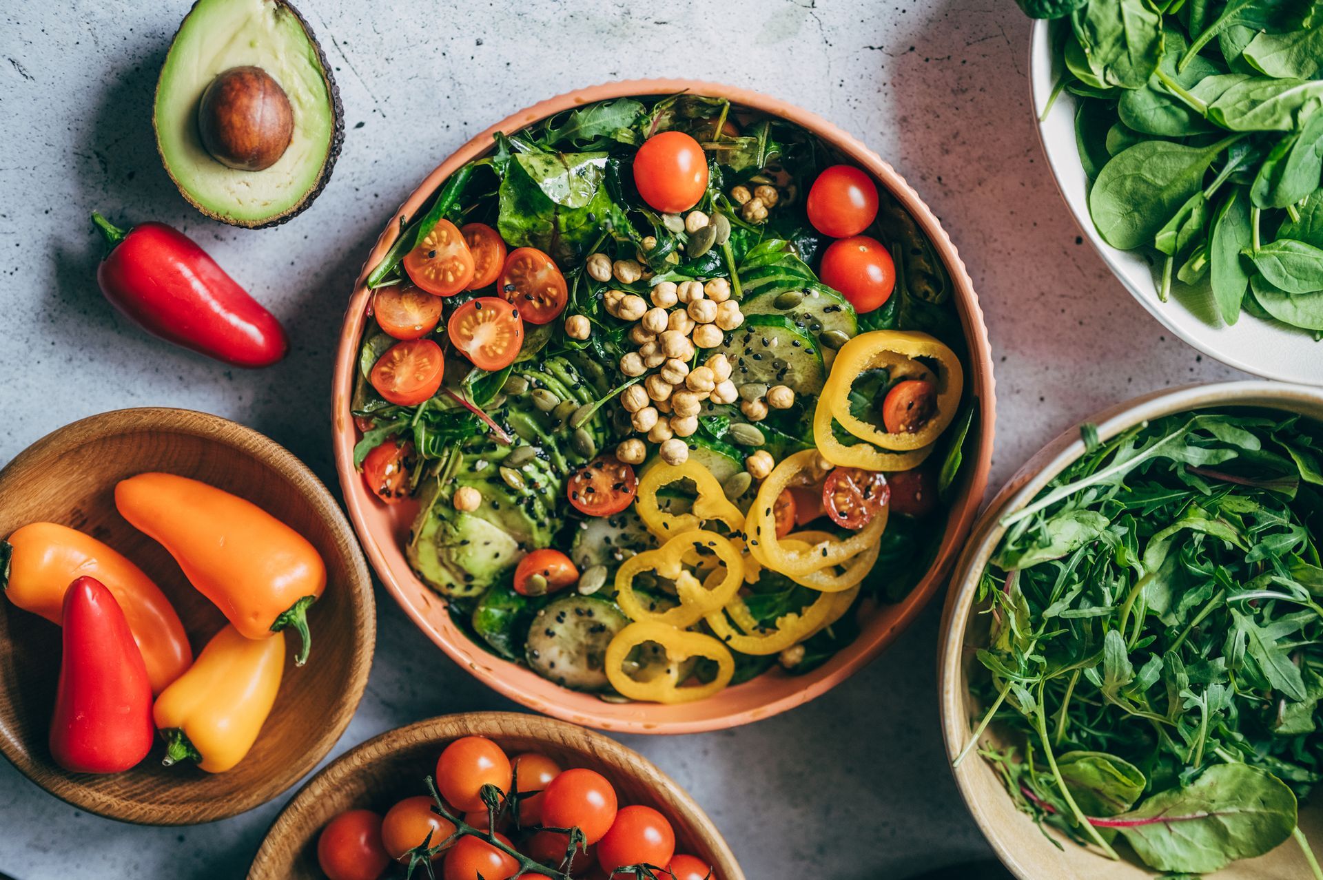 Fresh salad with colorful vegetables & nuts, perfect for a healthy meal at a vegan food restaurant.