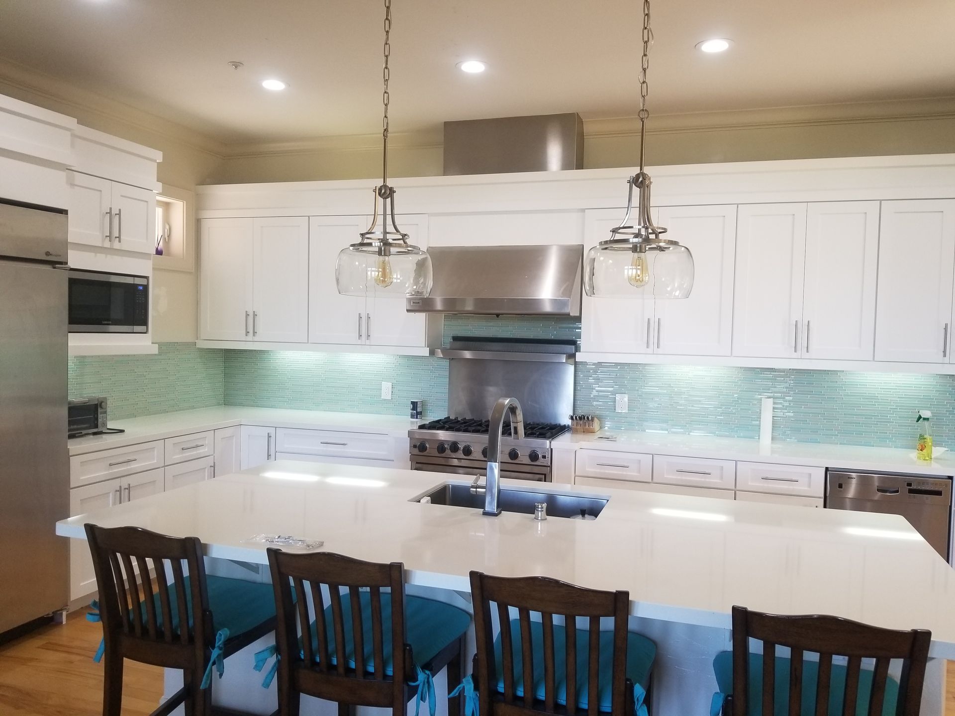 There is a large island in the middle of the kitchen.