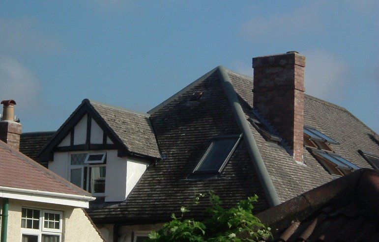 A house with a brick chimney on the roof