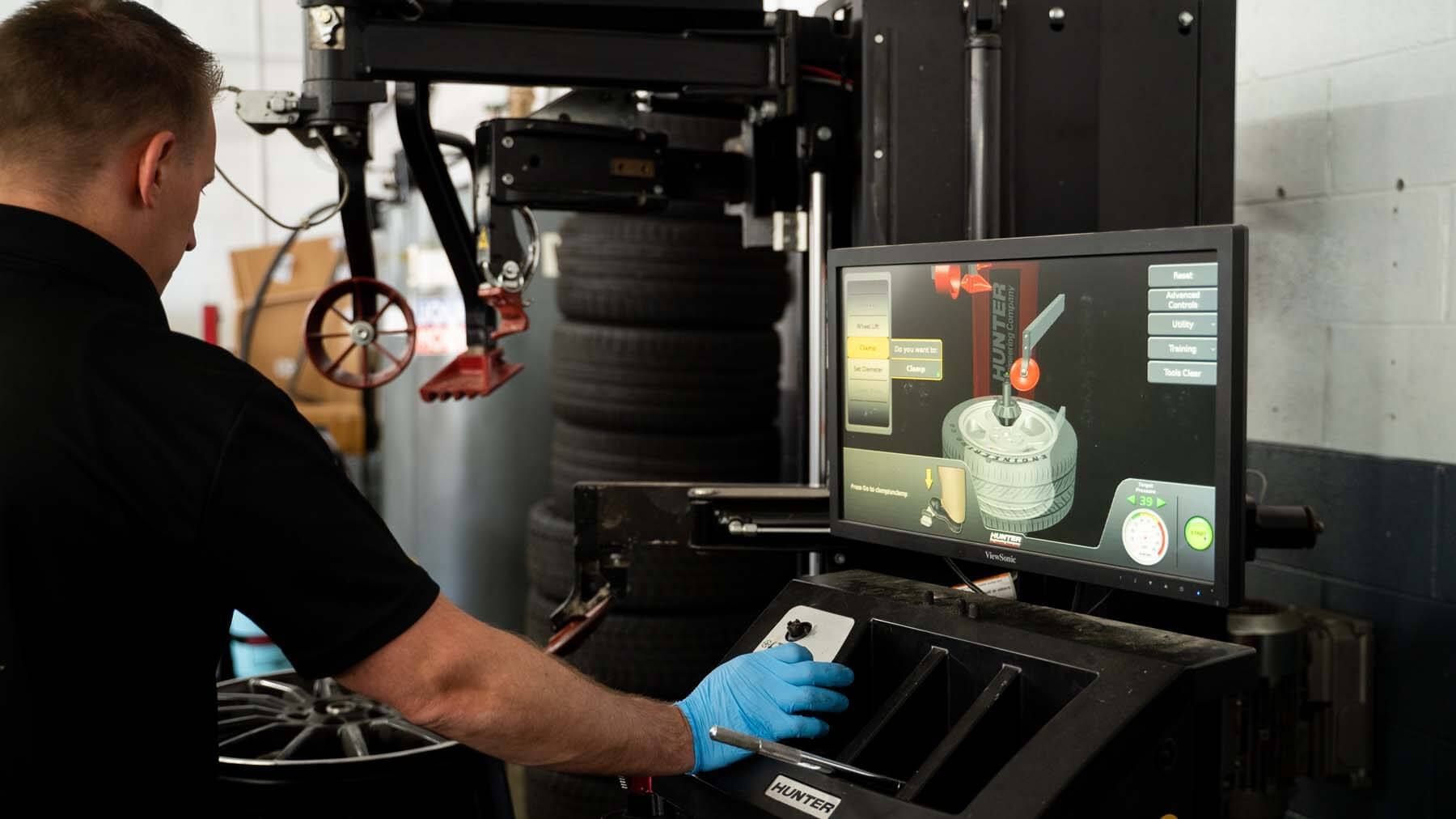 A man is working on a machine in a garage. | The Euro Shop