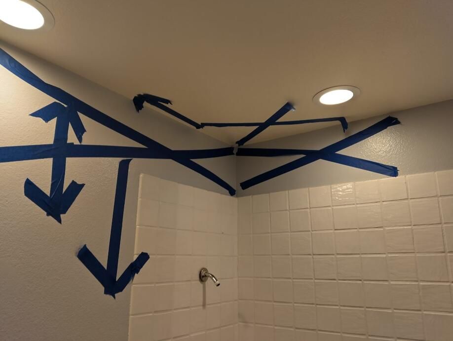 A bathroom with arrows painted on the wall