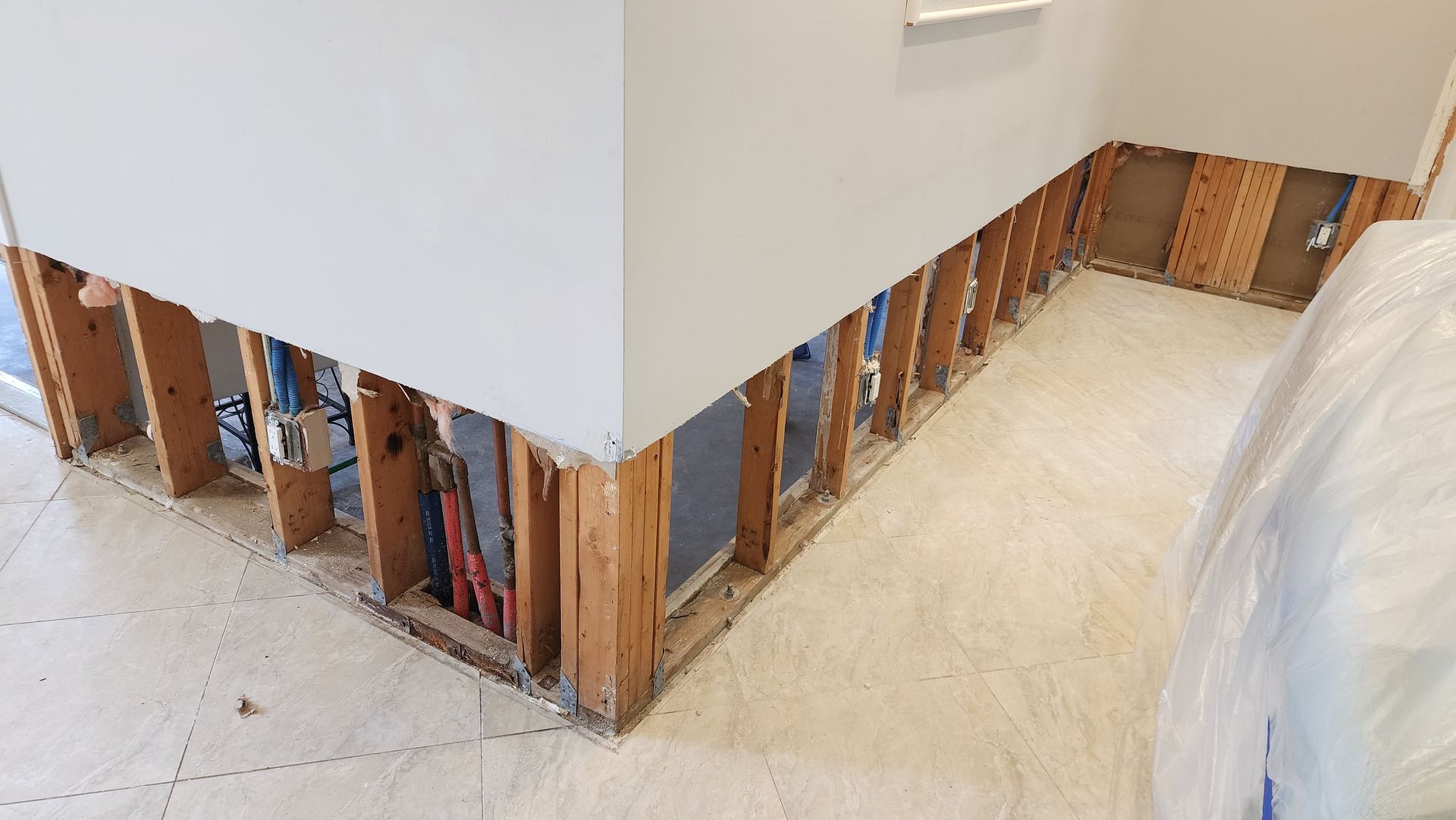 A room with a lot of wooden walls and a white floor.