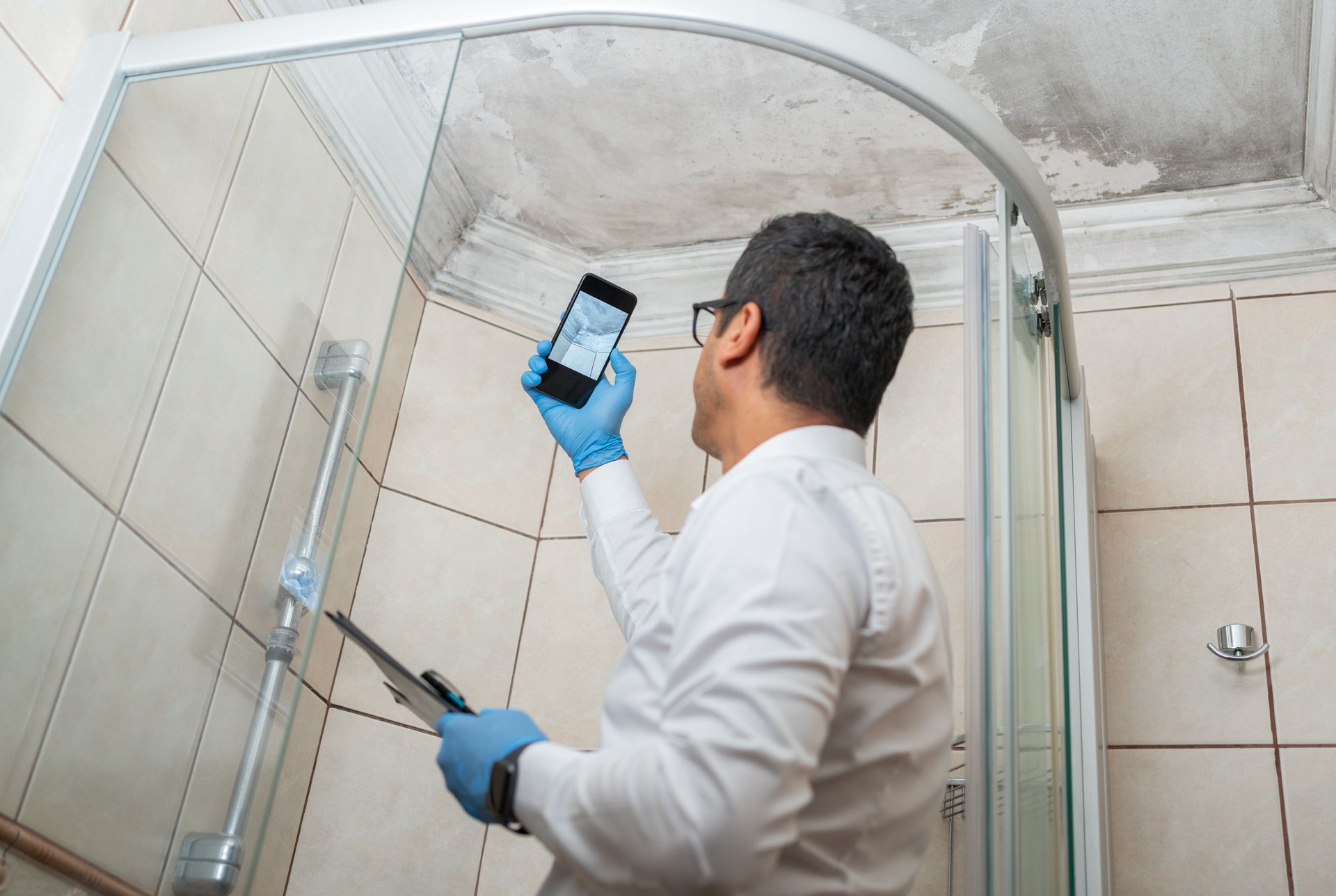 Image of a sanitary worker man offering commercial mold inspection service.