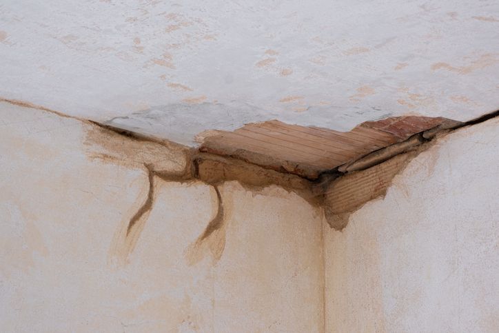 A corner of a room with a leak in the ceiling. A corner of a room with a leak in the ceiling.