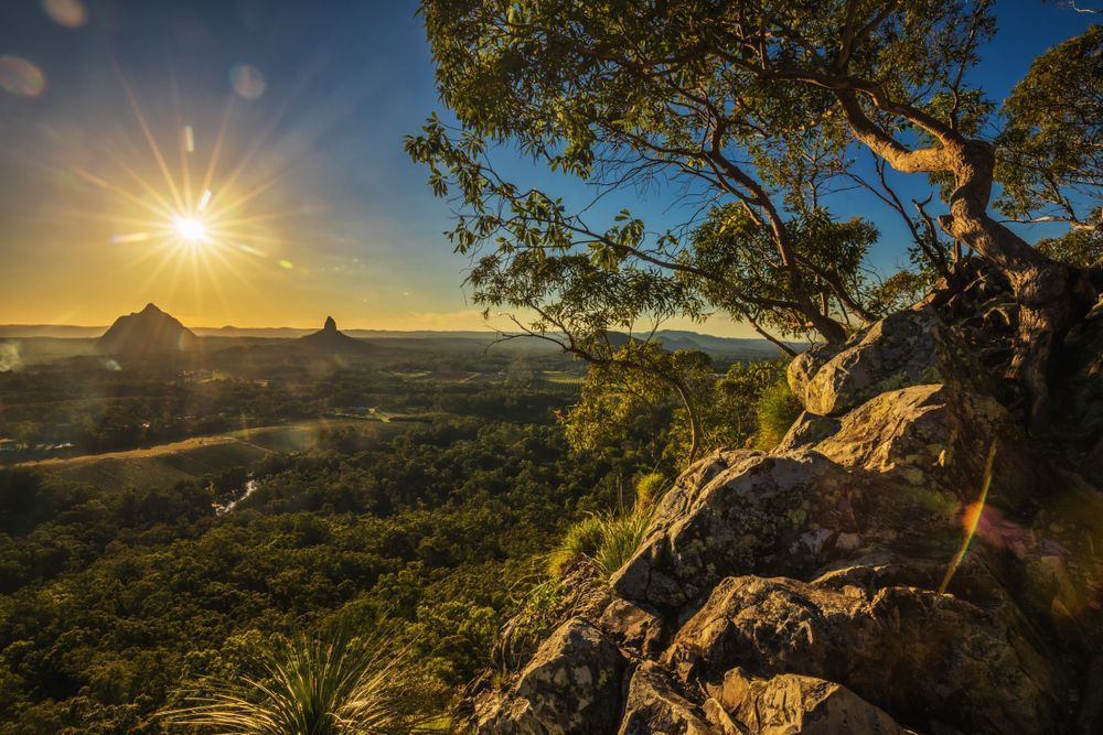 The Sun is Shining Through the Trees on a Mountain — R2B Heavy Vehicle Driving School in Rural View, QLD