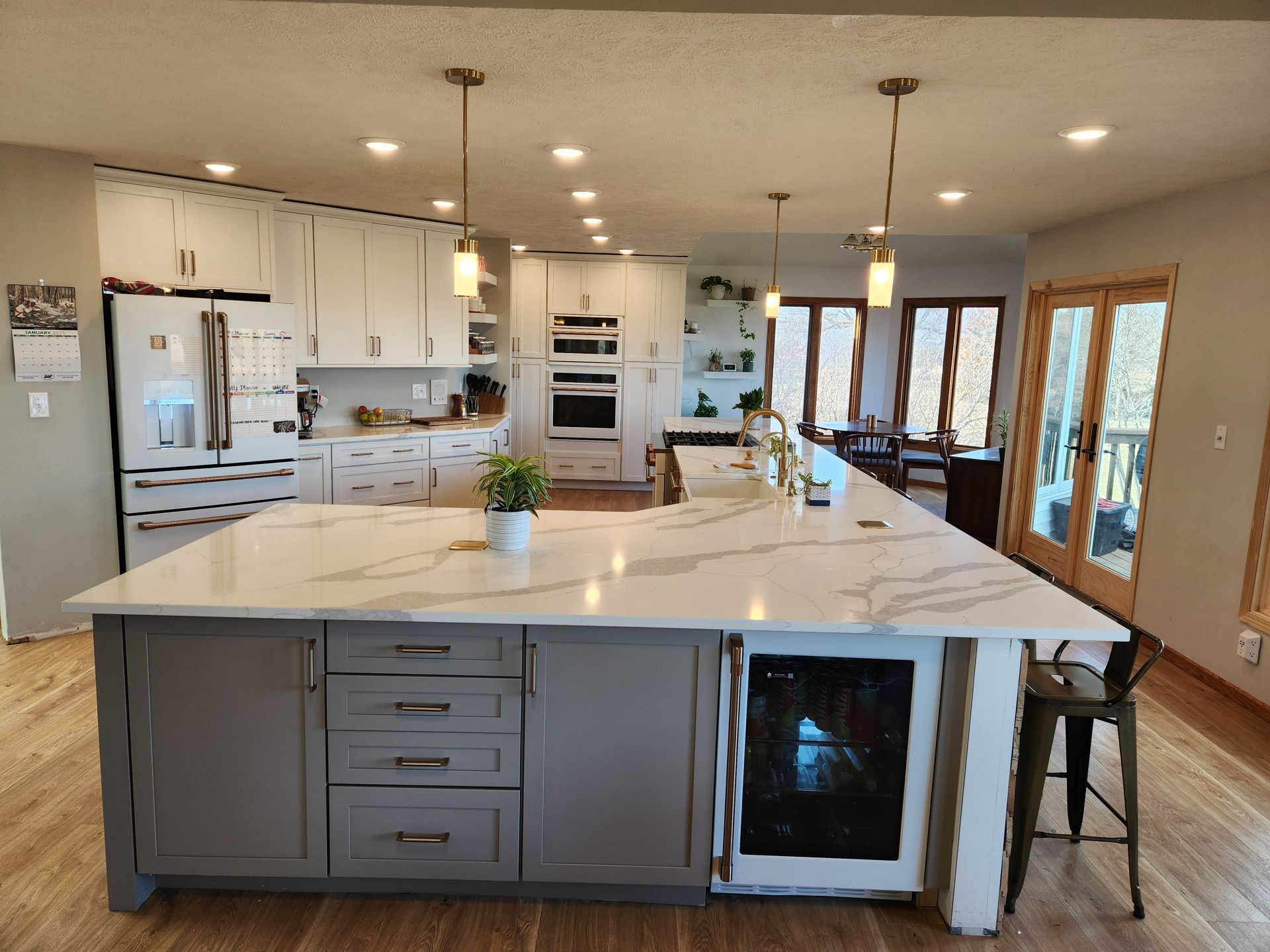 There is a large island in the middle of the kitchen.