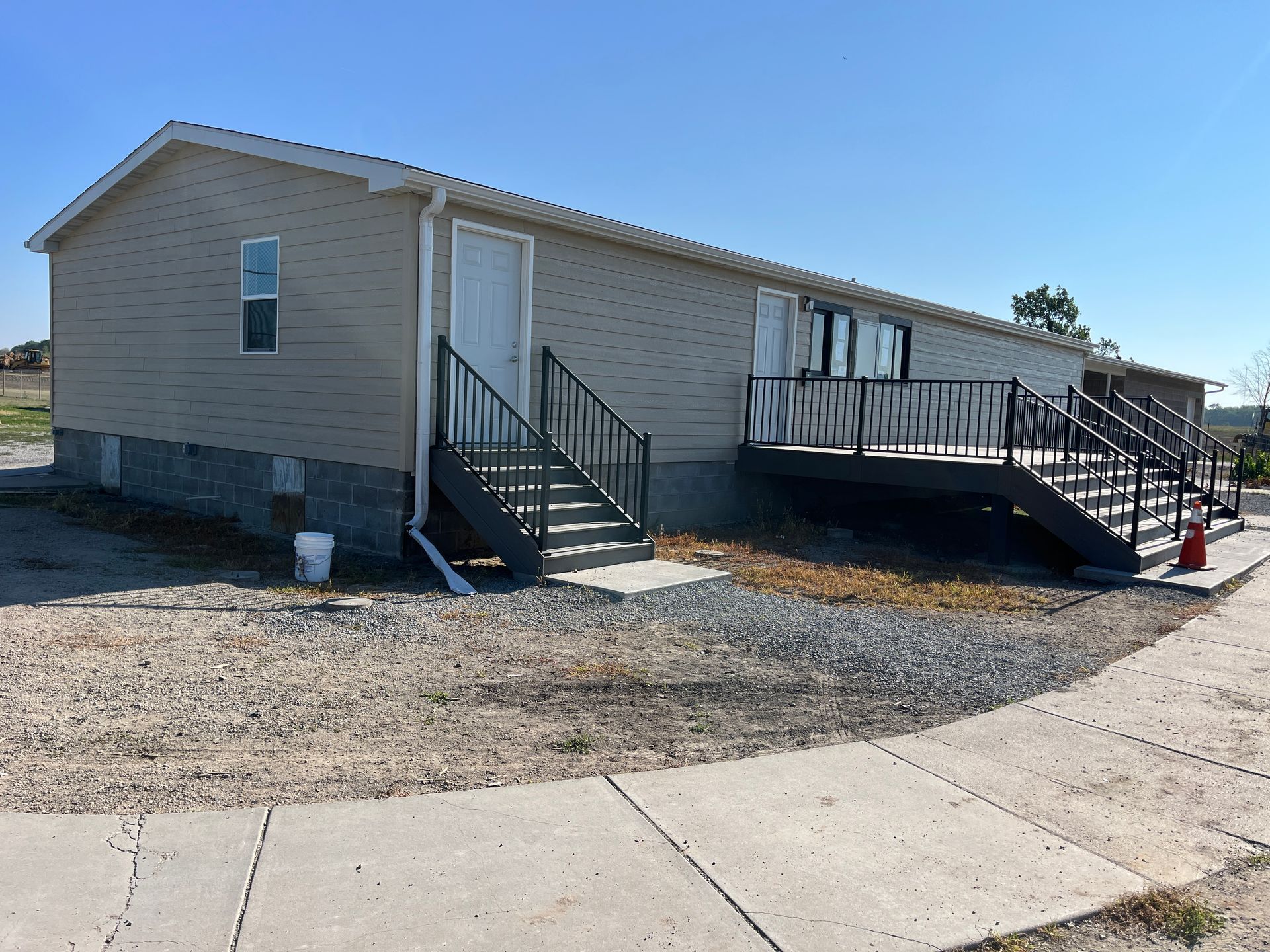 A mobile home with stairs leading up to it