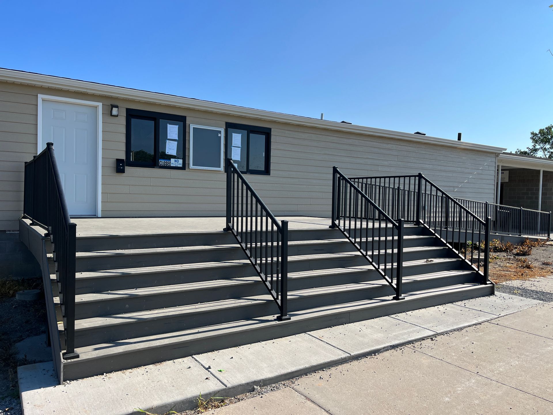 A house with stairs leading up to the front door
