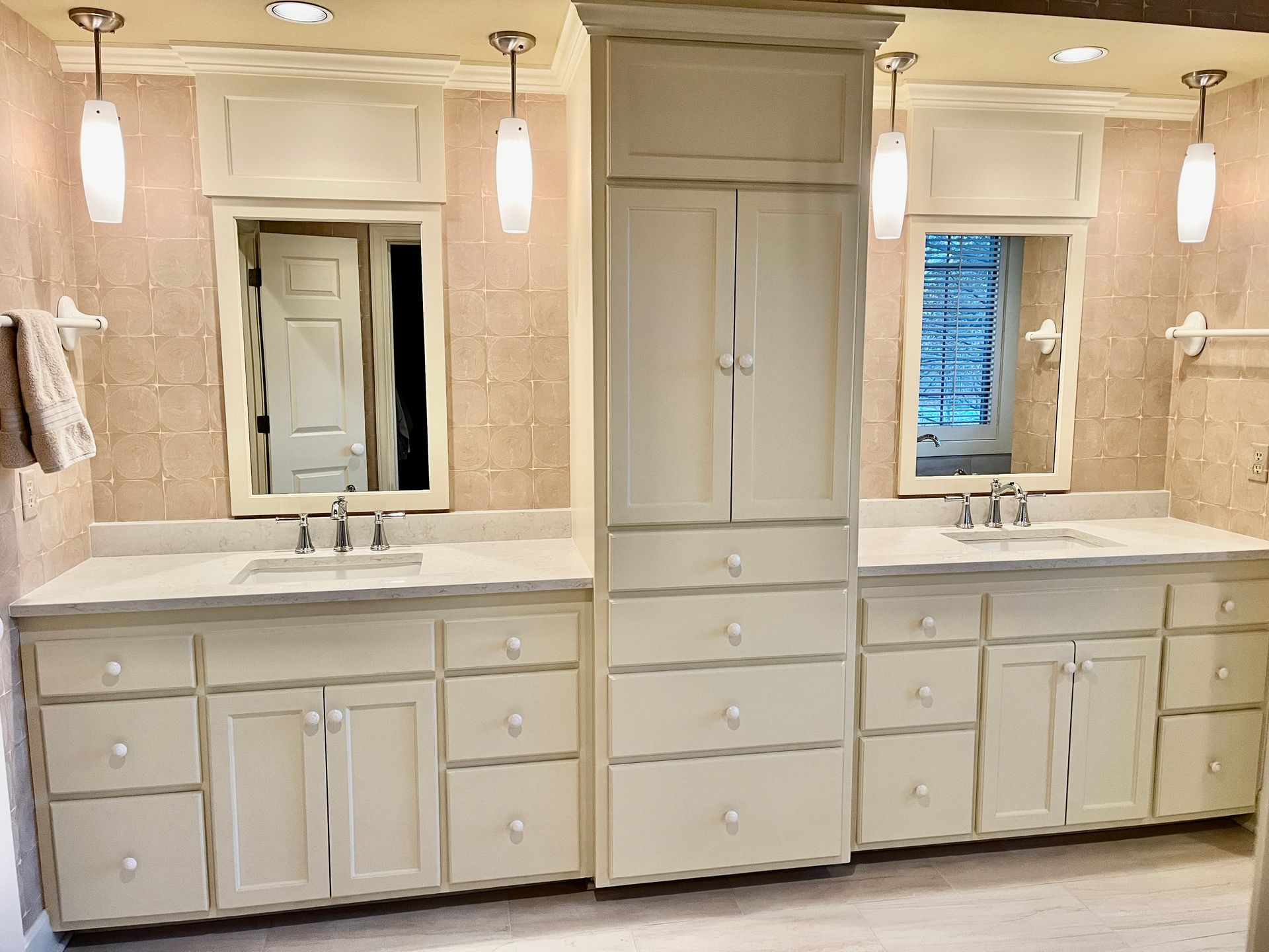 A bathroom with two sinks and two mirrors.