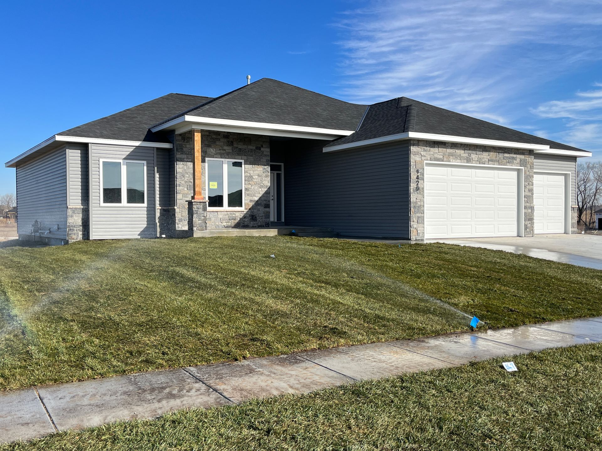 A large house with a lot of grass in front of it.