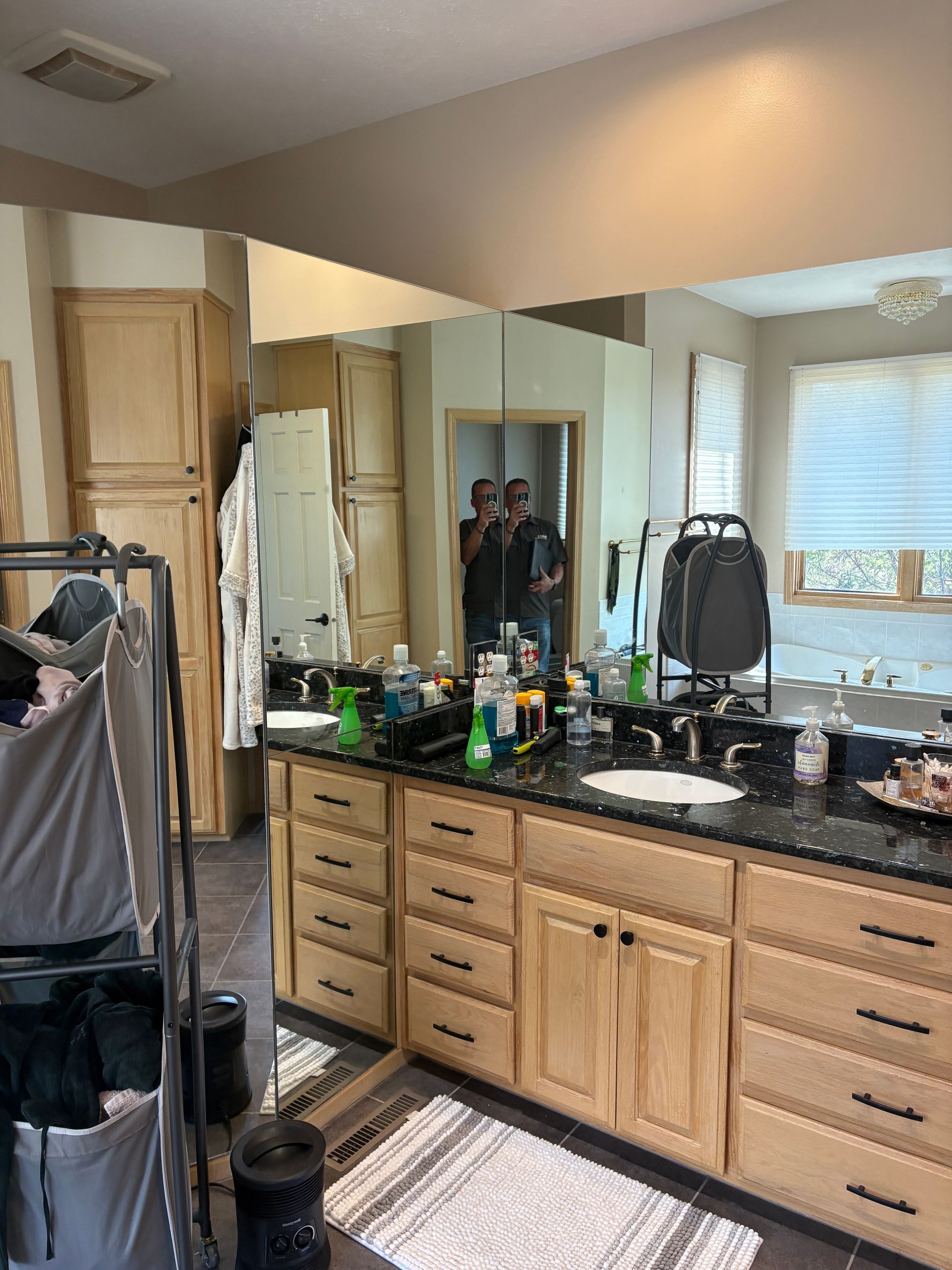 A bathroom with a toilet , sink , tub and shower.