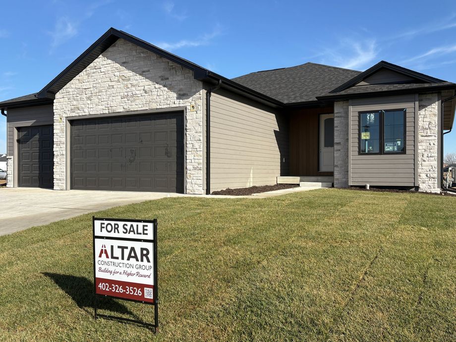 House for sale, modern design, brick facade, garage, and a 