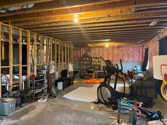 There is a basketball hoop in the middle of the room.