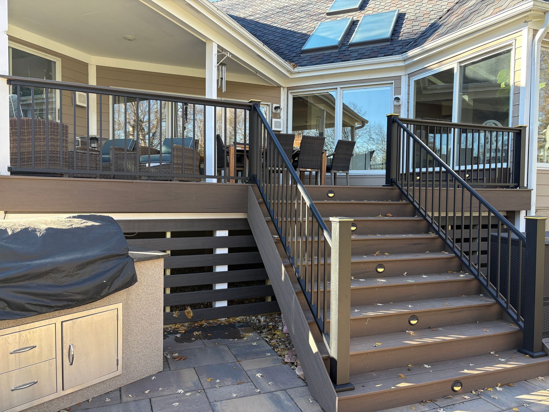 A large deck with stairs leading up to it