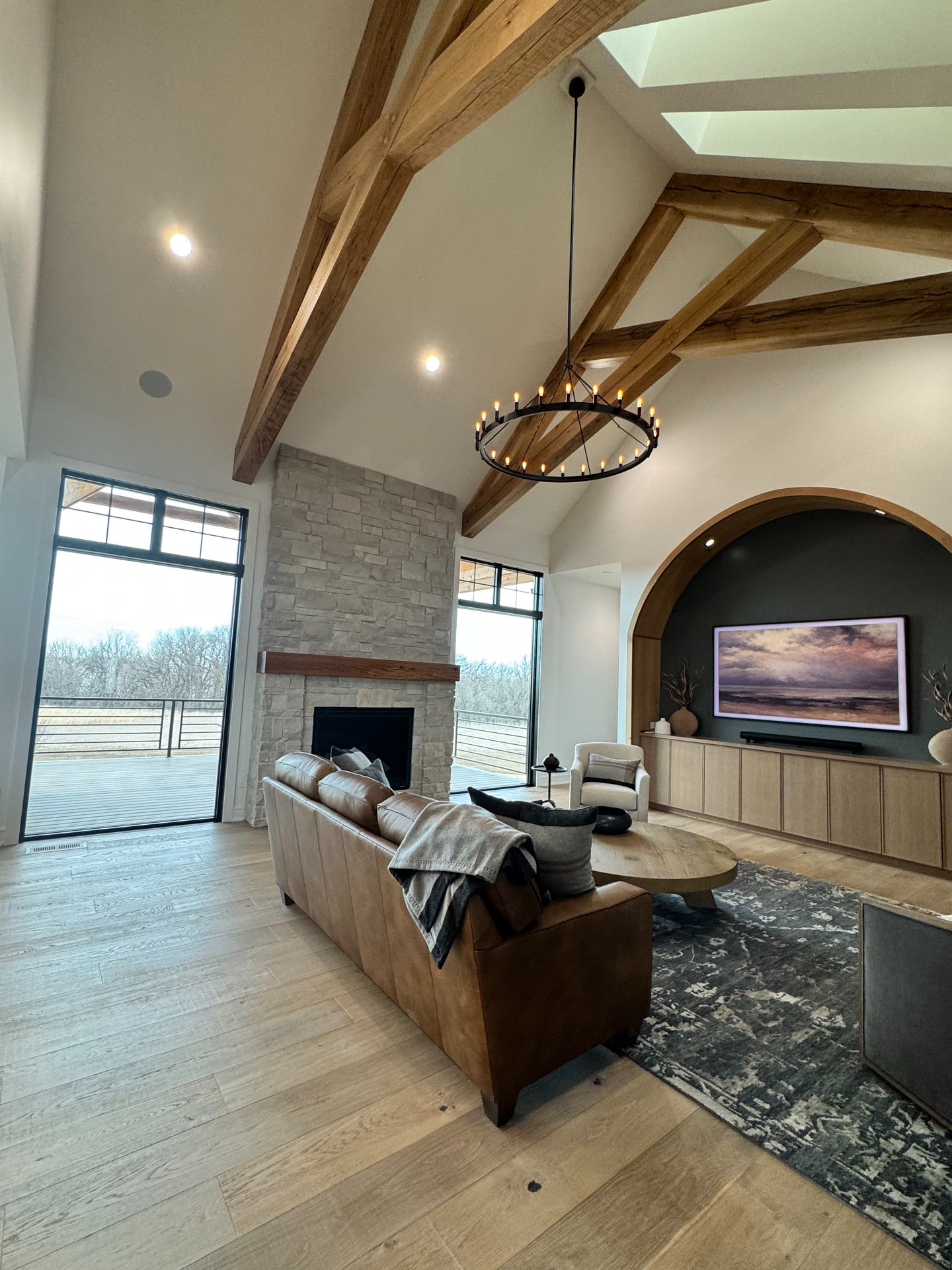 A living room with a couch , fireplace , and television.