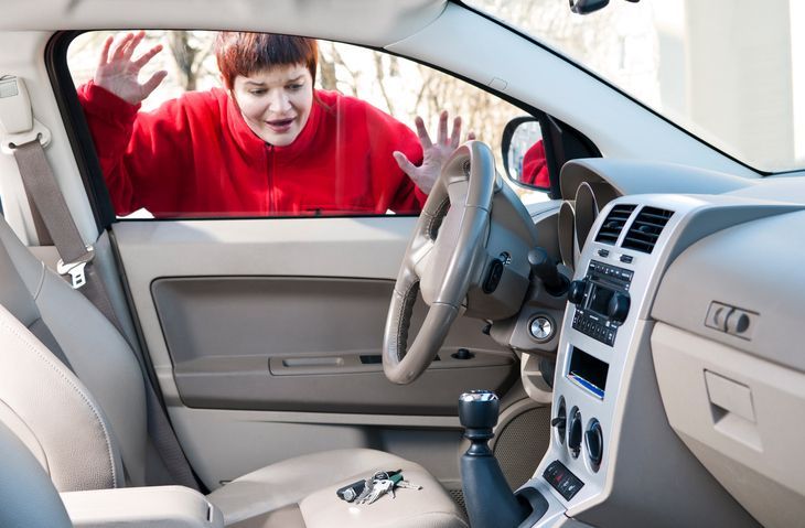 A woman in a red sweater left her keys inside the car