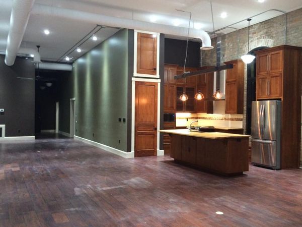 a kitchen with wooden cabinets and stainless steel appliances