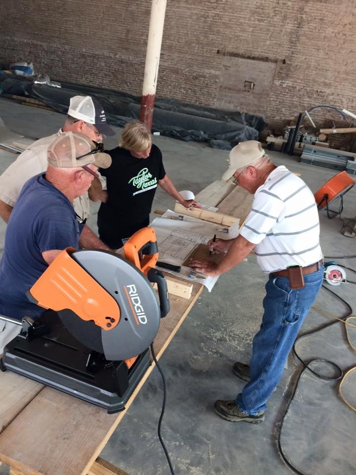 a man is using a ridgid circular saw to cut a piece of wood