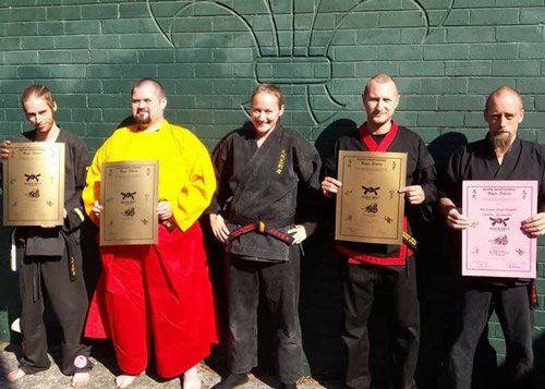 ninja trainers holding certificates