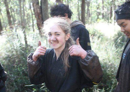 ninja training girl with thumbs up