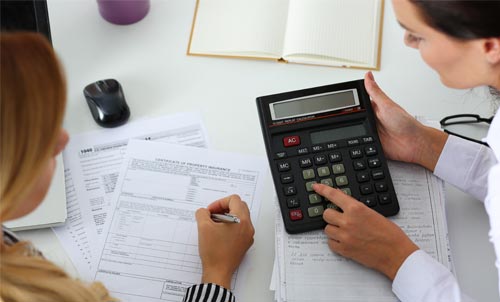 Professional showing the result on calculator