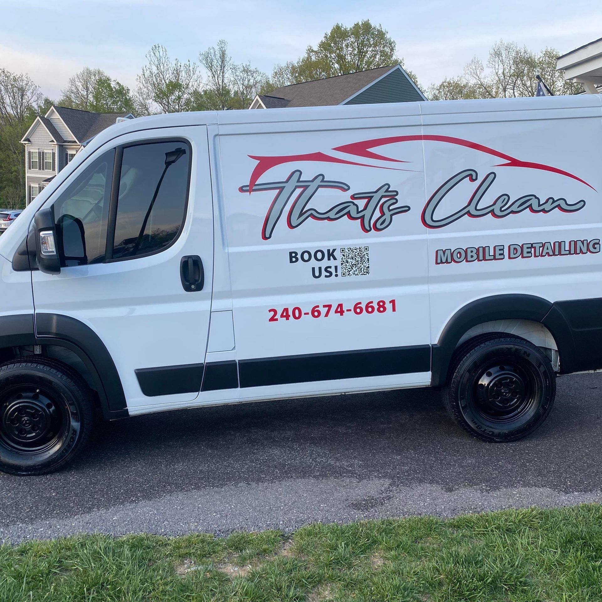 A that 's clean van is parked on the side of the road