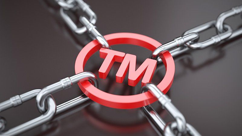 red TM being pulled by chains