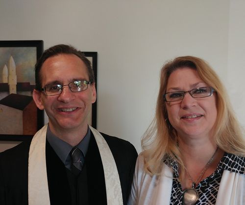 A man and a woman are posing for a picture